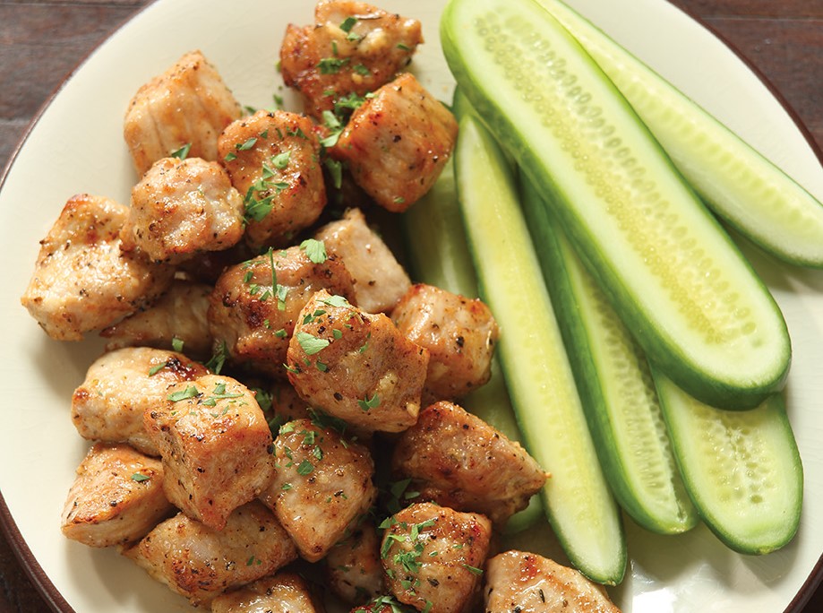 Air fried pork bites with cucumbers.