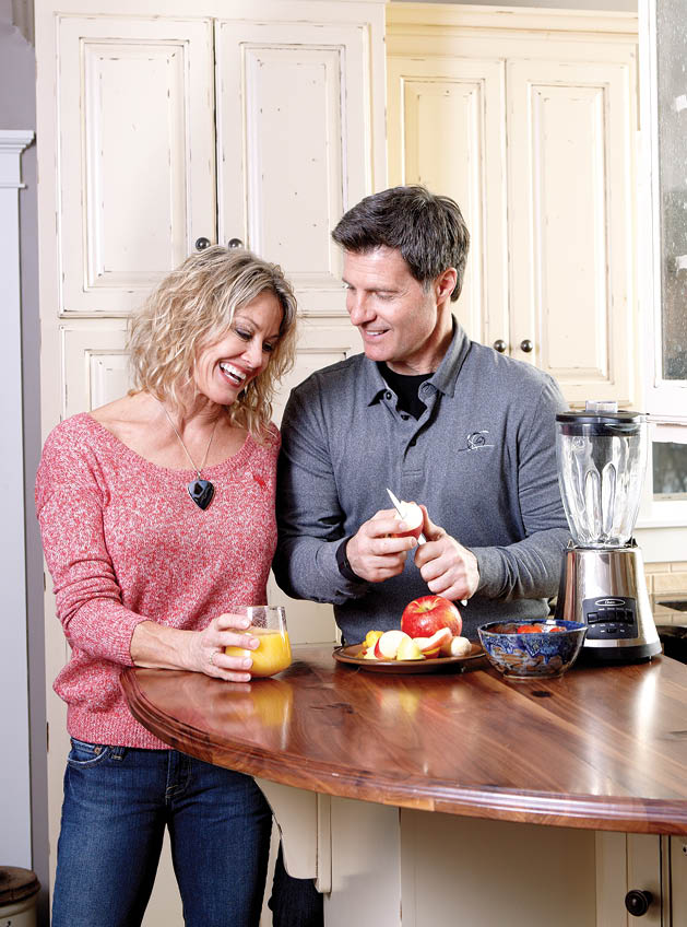 Kami and Randy Meier making a fruit smoothie together in their Afton home.