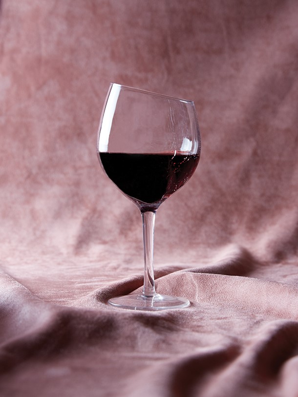 Glass of Red Wine with Pink Backdrop