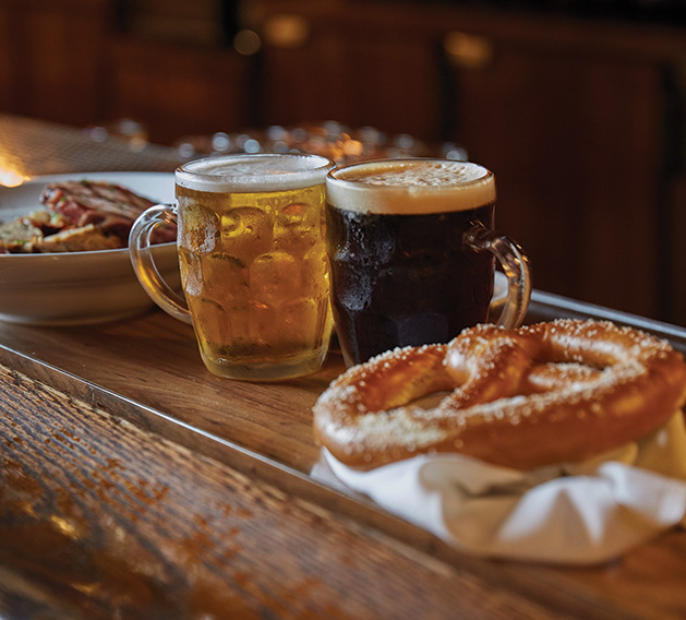 Traditional German beers and a pretzel at the Winzer Stube's Oktoberfest celebration.