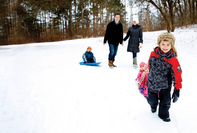 Dave and Annie Berthiaume enjoy the outdoors with their kids Louis, 7, (red jacket); Peter, 5, (blue jacket ); Marie, 4, (pink jacket) and Frances, 2, (pink jacket with brightly colored scarf).