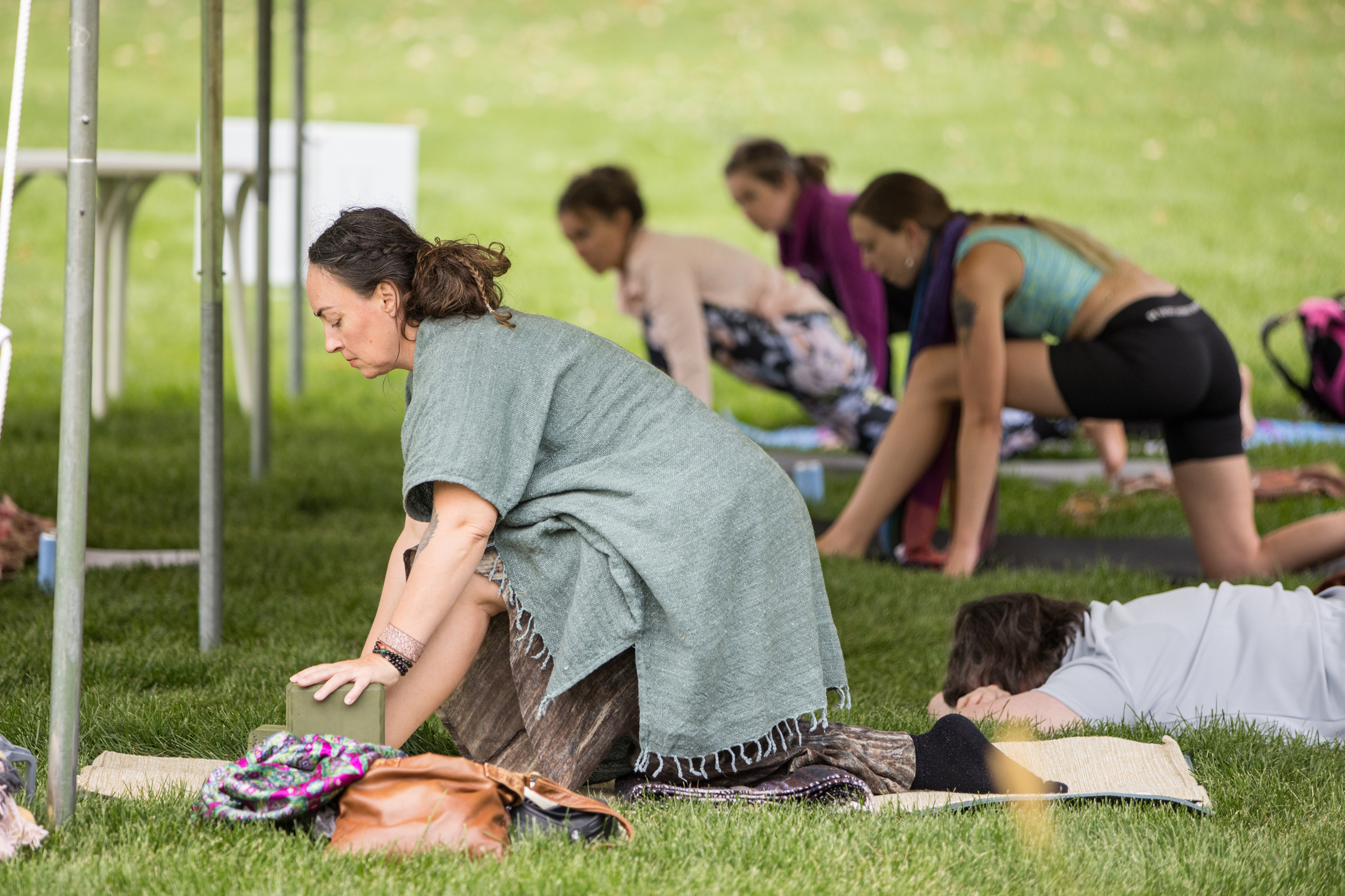 Yoga practitioners using blocks