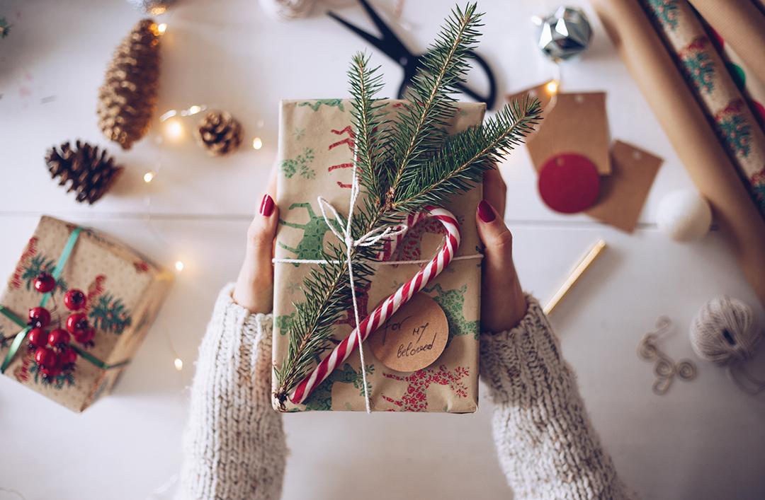 Young woman holding Christmas gift