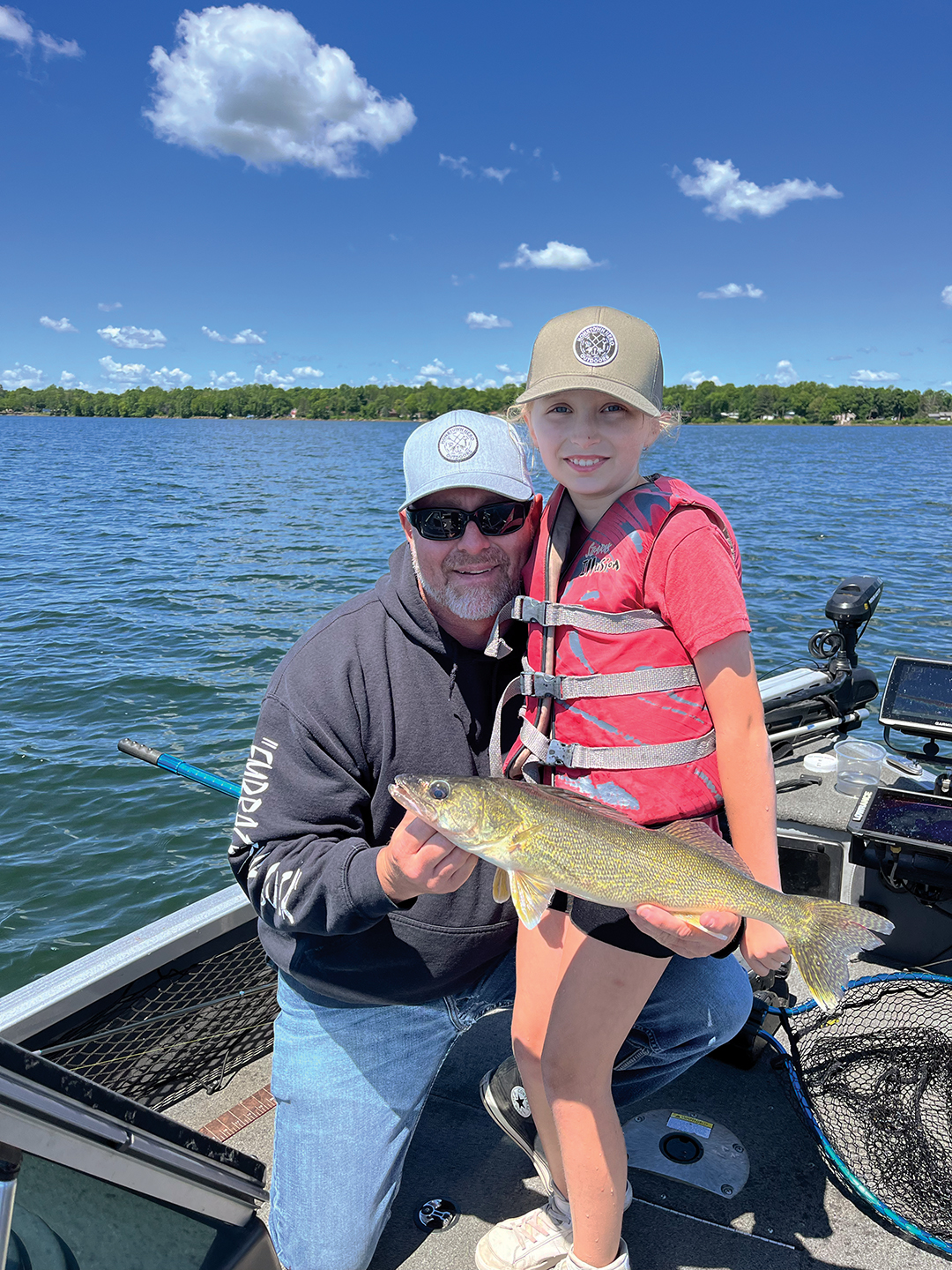Dave and Sadie Crist enjoy a fishing excursion on Lake Mille Lacs with Hometown Hero Outdoors.