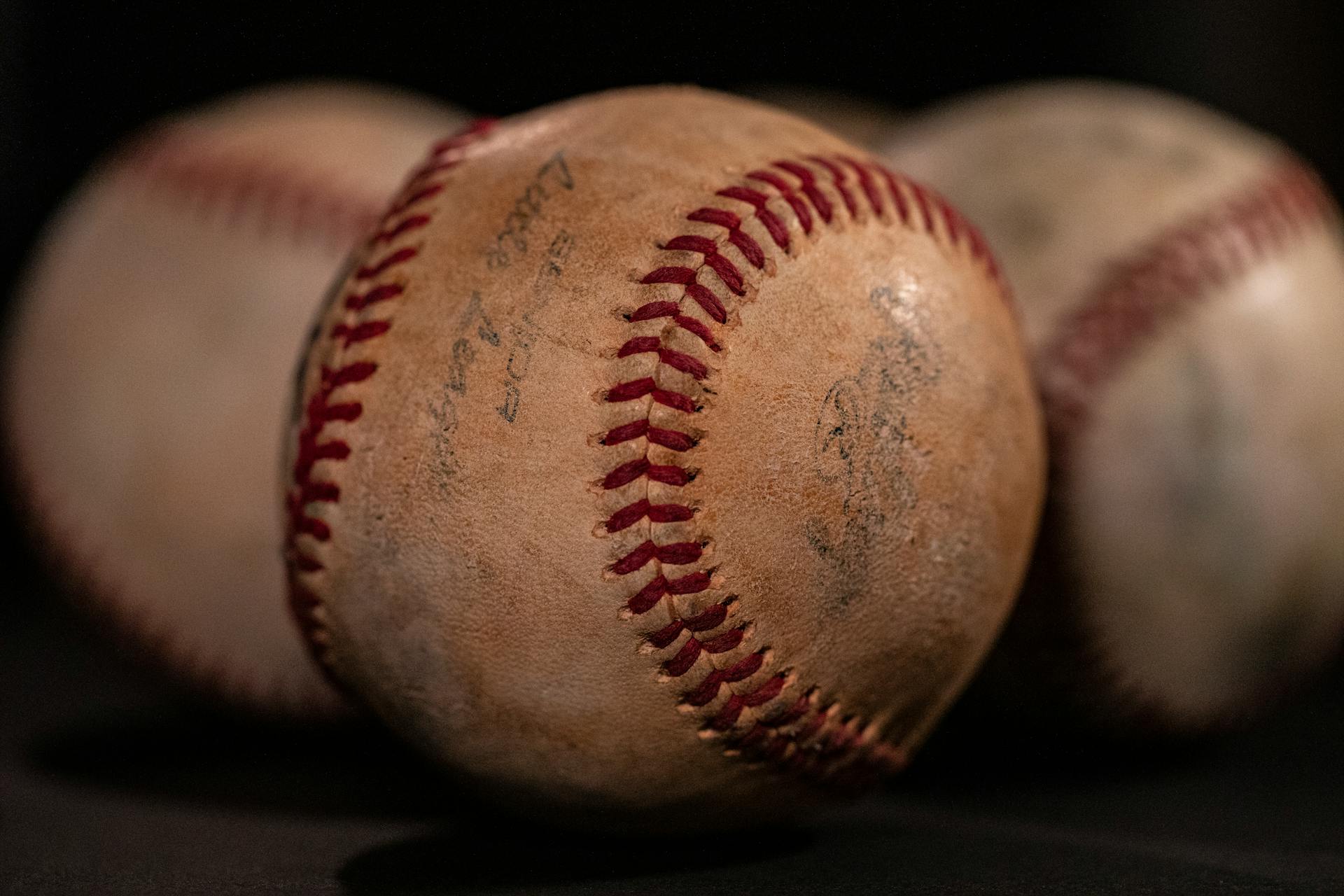 Three vintage baseballs