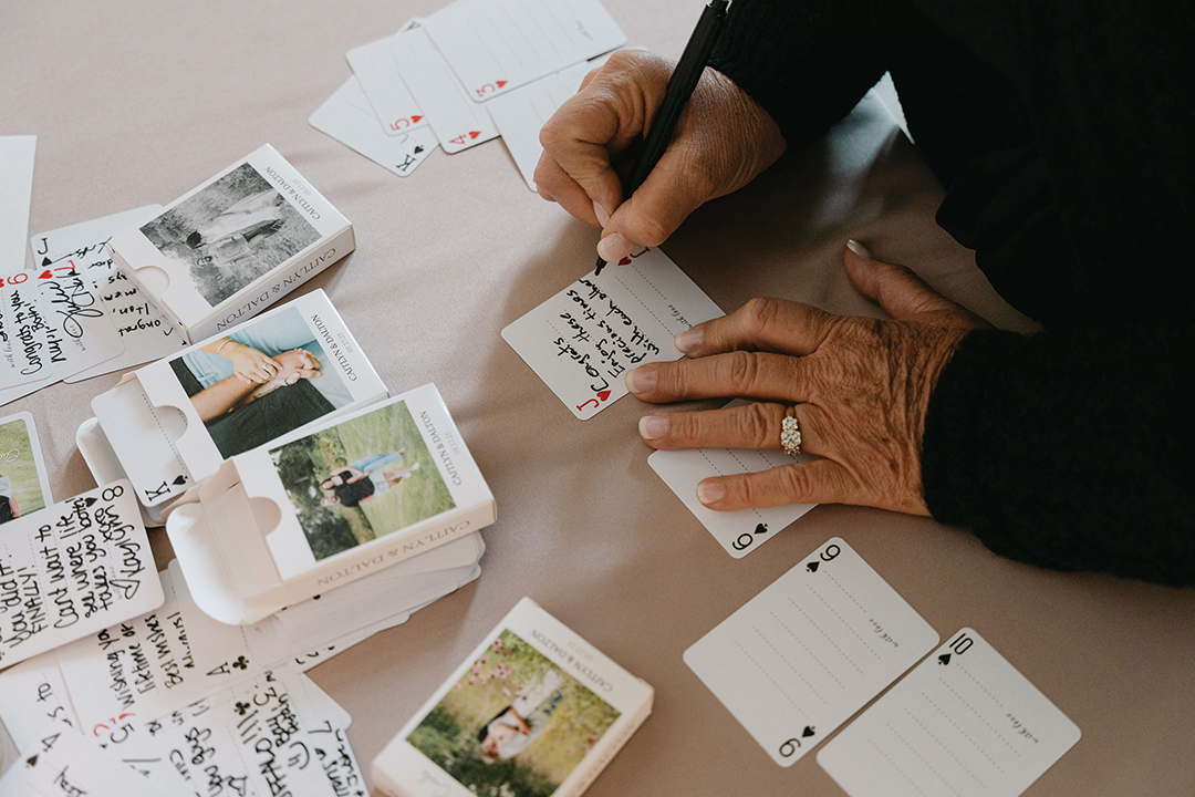 In lieu of a traditional guestbook, the Lyonses opted to have guests sign individual playing cards. These notes and names will be a part of game nights for years to come. 