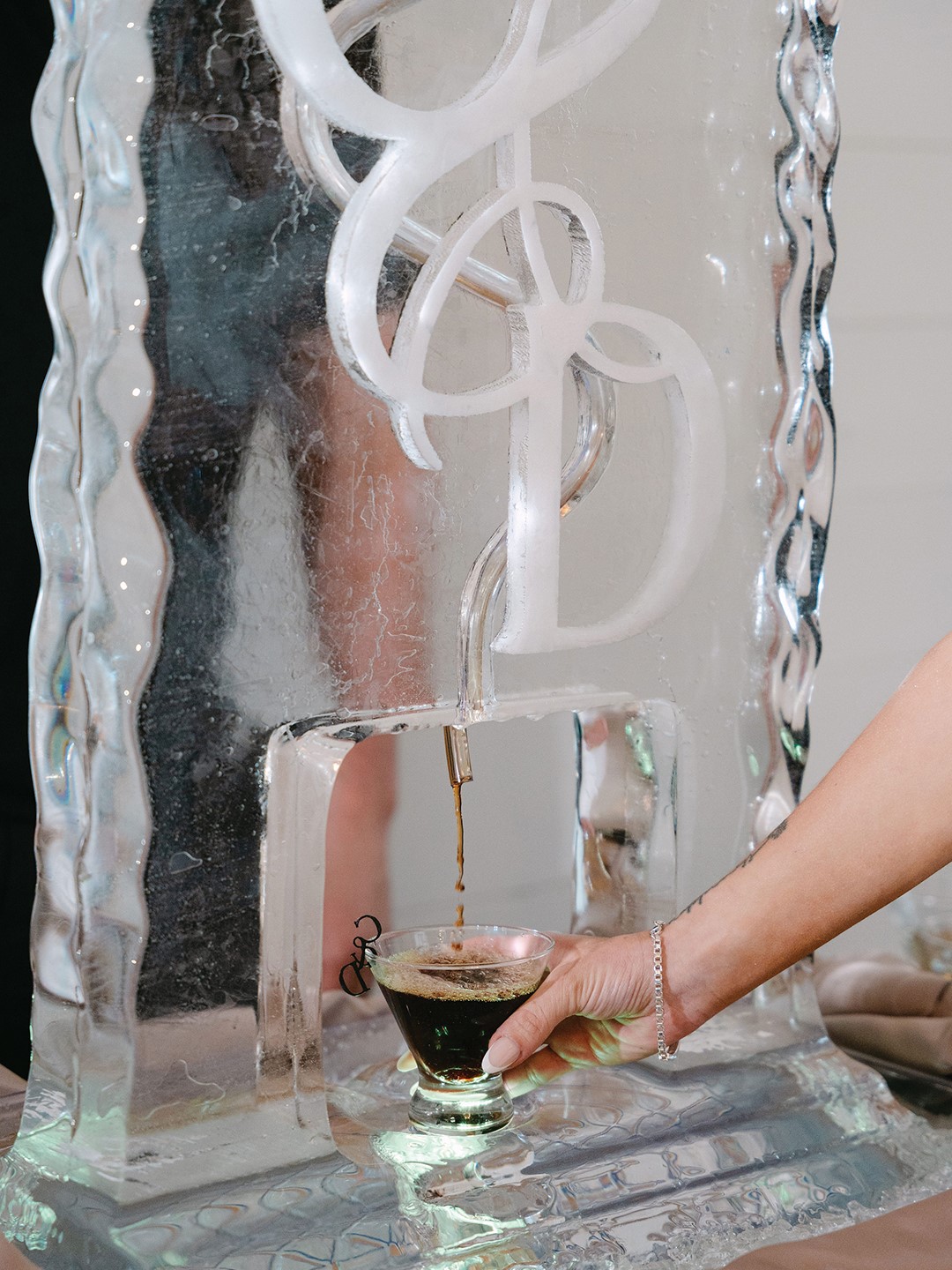 Caitlyn and Dalton Lyons knew they wanted to incorporate their favorite cocktail into their wedding reception. This Espresso Martini luge by Minnesota Ice proved a memorable addition to the day. 