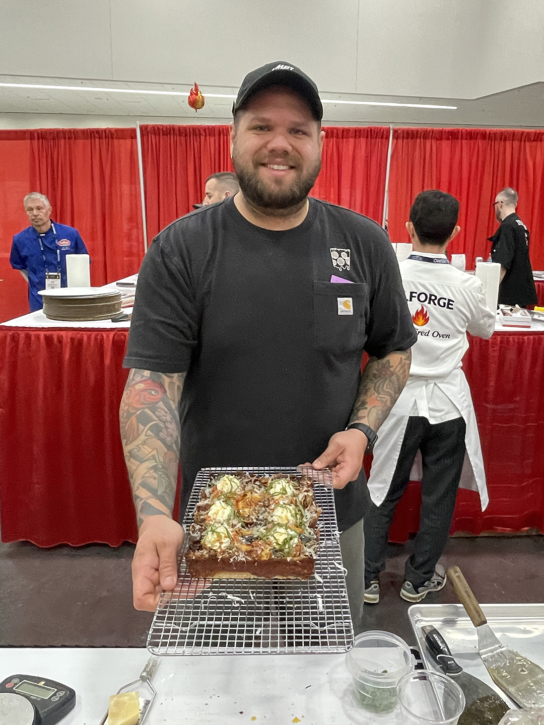 Anthony Gilbert holding a pizza
