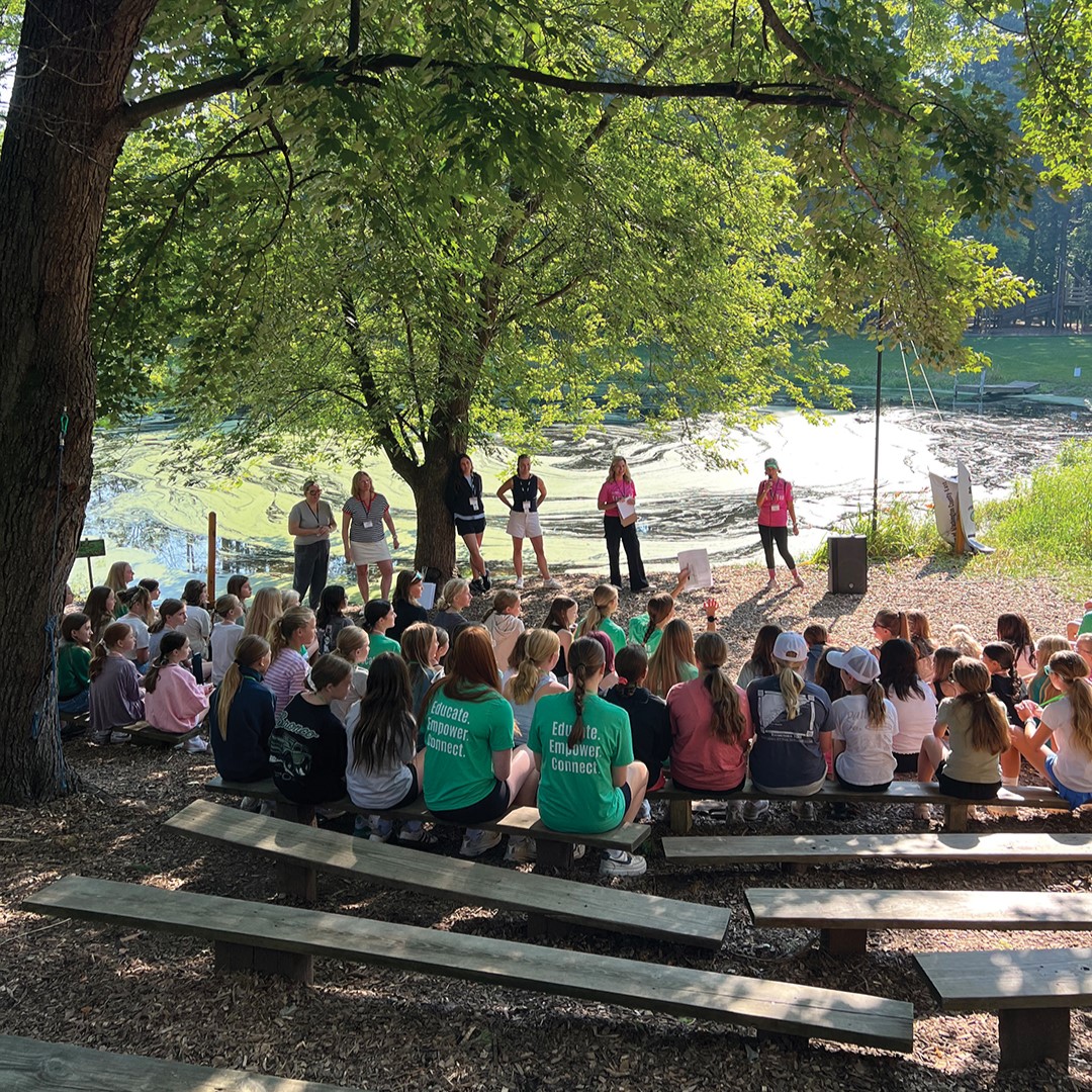 The group gathers for a flag ceremony at the You R You retreat in 2025.